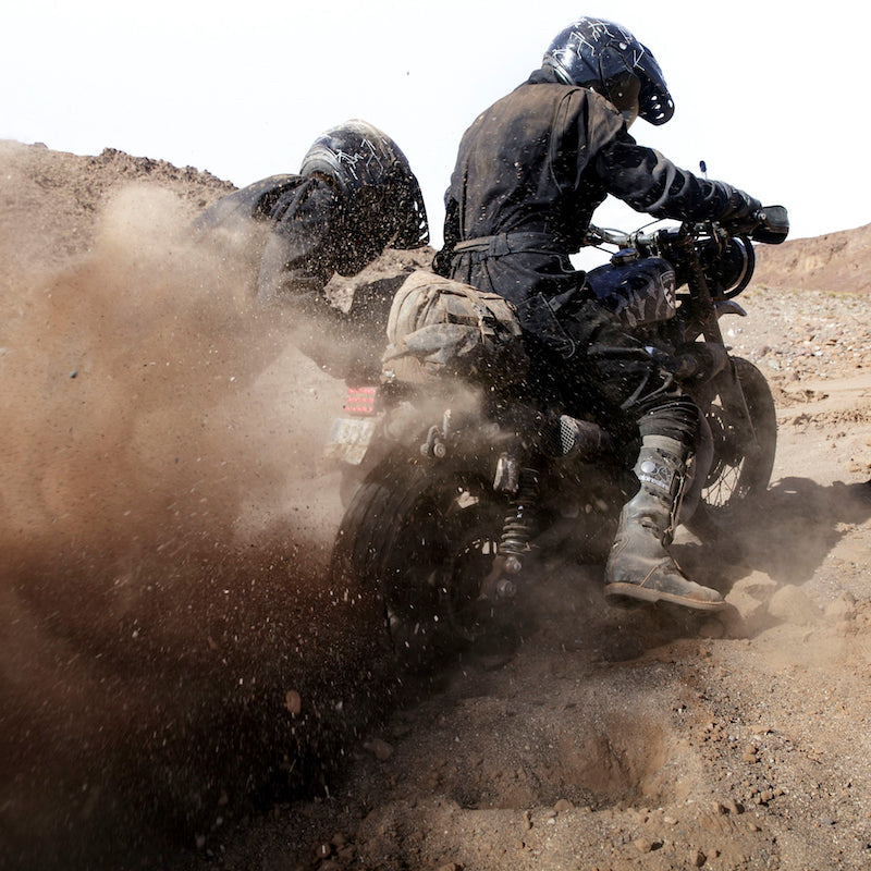 Harley-Davidson kicking up sand in the Sahara desert — El Solitario Desert Wolves
